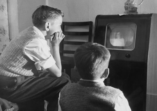 Huddling around the TV in the 1930s.